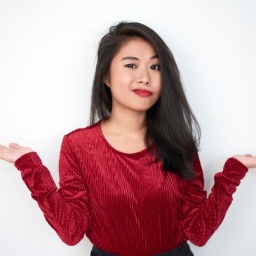 Confused woman in red shirt